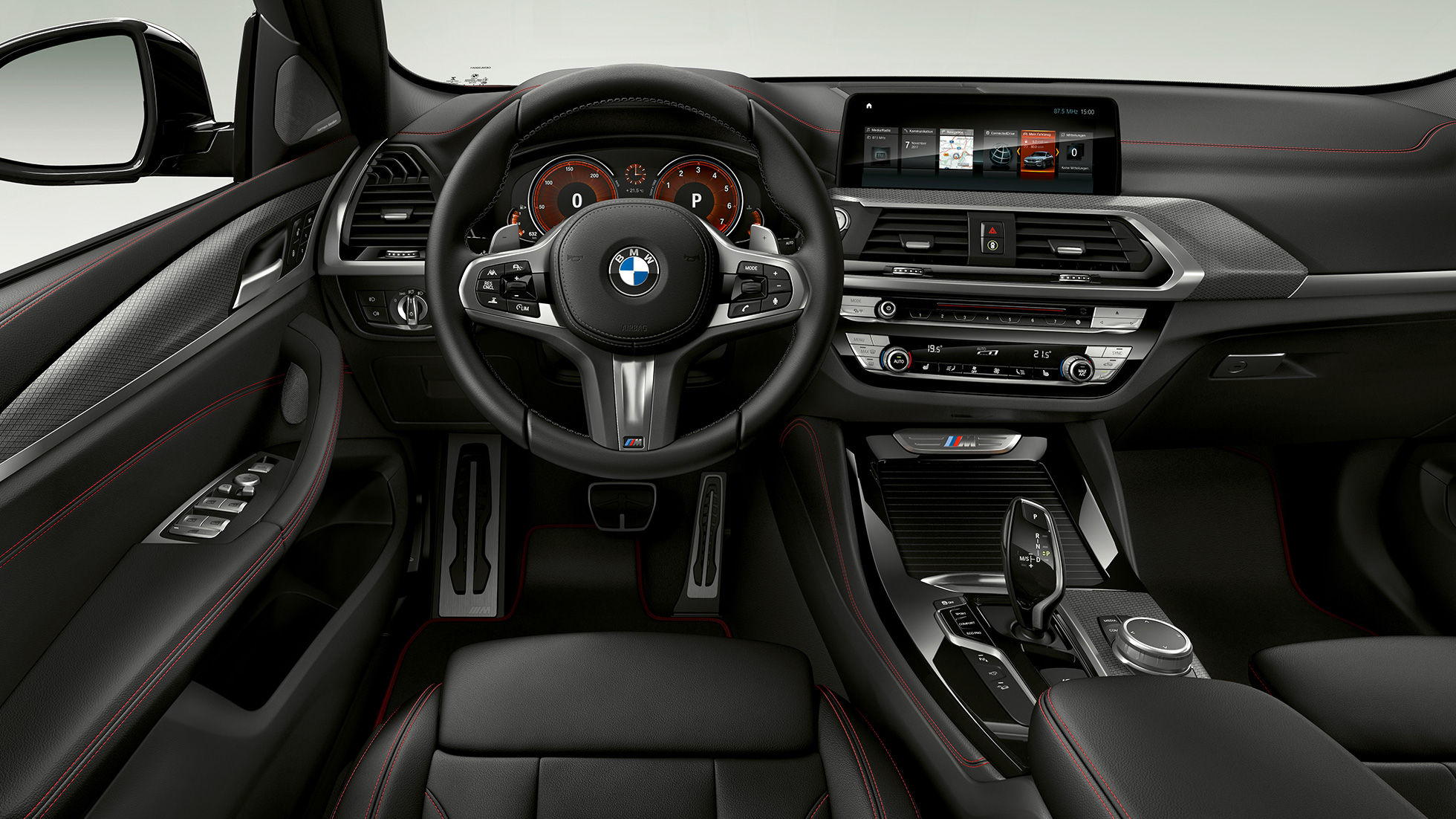 BMW X4 M40i and BMW X4 M40d, cockpit. BMW X4 M40i and BMW X4 M40d, interior, cockpit with sport seats and M leather steering wheel.